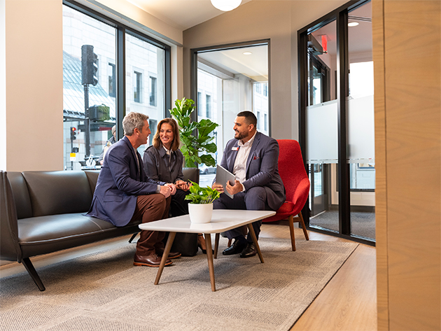 Banker at desk with client